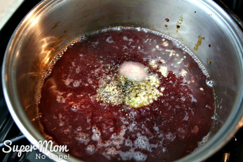 Mix together cranberry sauce, pineapple juice and spices in sauce pan