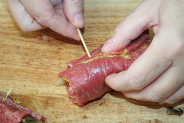 Roll up beef and secure with a toothpick