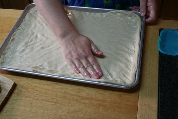 Pat dough out until it fills the pan