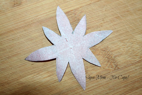 Score the backing paper with a sharp pin.