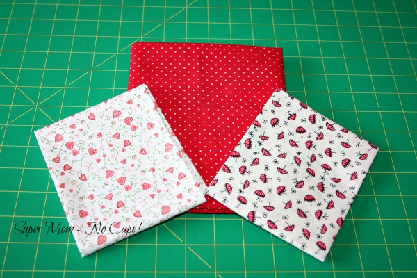 three different red print fabric fat quarters
