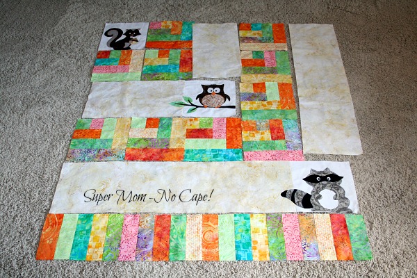 One Big Cabin blocks laid out on the floor