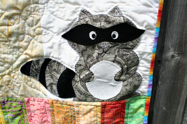 The appliqued raccoon on my Forest Friends Quilt.