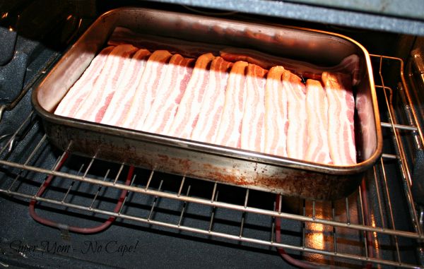 Place baking pan with bacon into the oven.