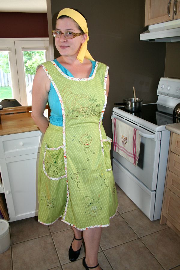 another photo of middle daughter modeling the apron