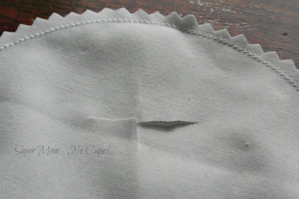 An X cut into the top layer of fabric circle