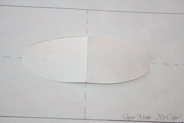 17b. Place paper oval on pattern and trace around it.