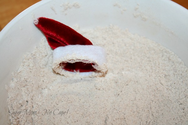 Tiny Santa hat in the flour