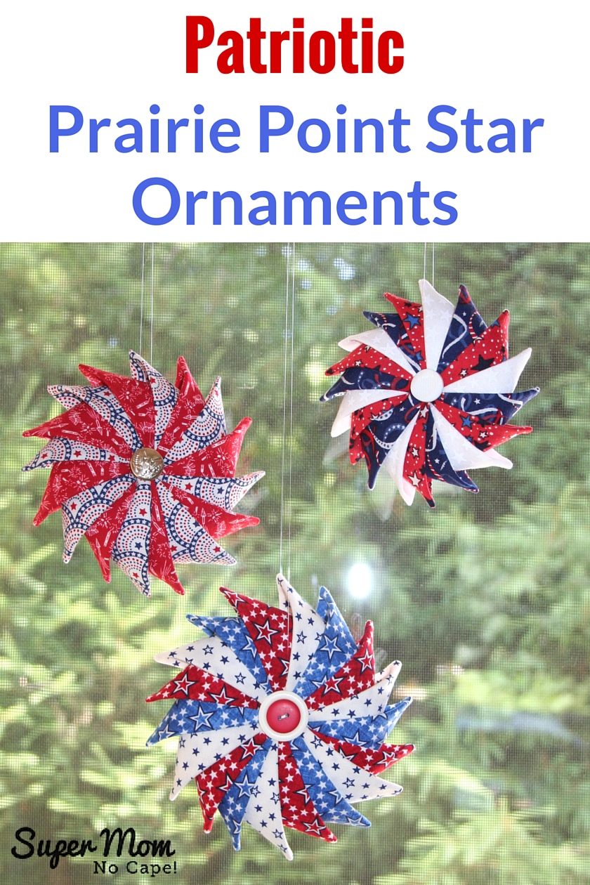 Three Patriotic Prairie Point Star Ornaments hanging in a window
