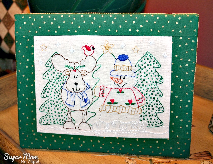 Reidneer and Snowman embroidery mounted on flat board