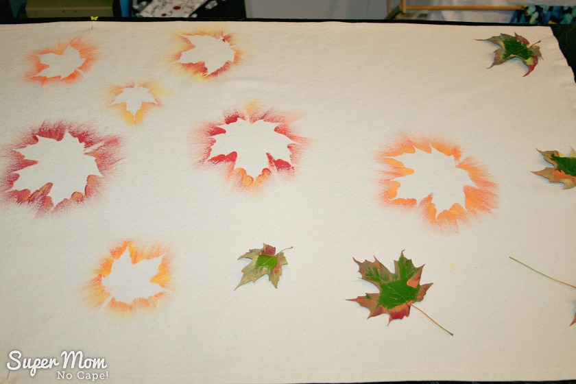 Several painted leaves plus addition leaves ready to be painted on the Painted Maple Leaf Table Runner