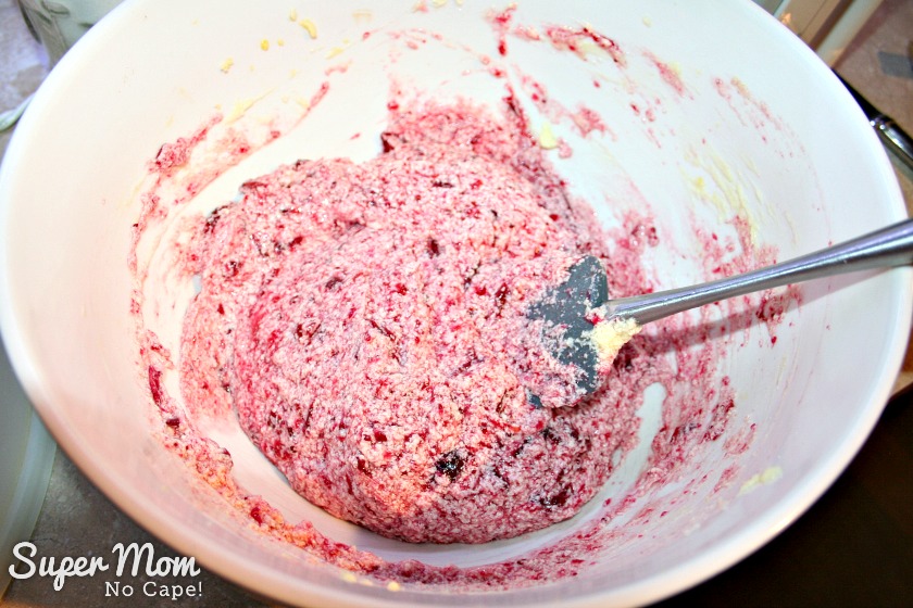Pink and red cookie dough for the Leftover Cranberry Sauce Drop Cookies after the cranberry sauce has been added.