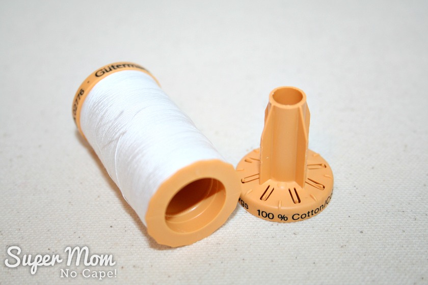 Gutermann thread spool with bottom removed to reveal hidden compartment