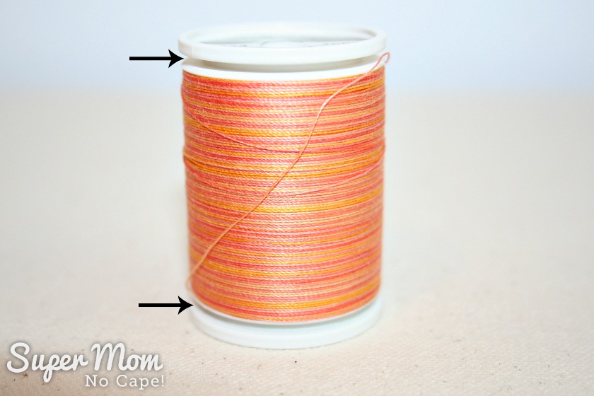 Sulky thread spool with top and bottom popped open