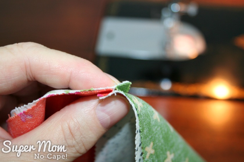 Photo showing how to nest the seams of the two sets of charms square together before sewing them together.