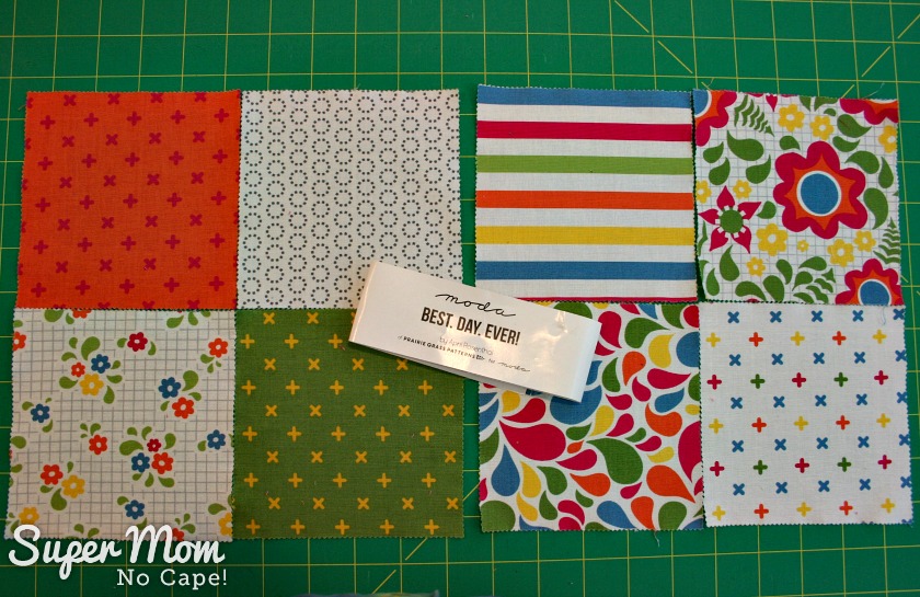 Photo of 8 charm squares leftover from Best Day Ever charm square pack from moda.