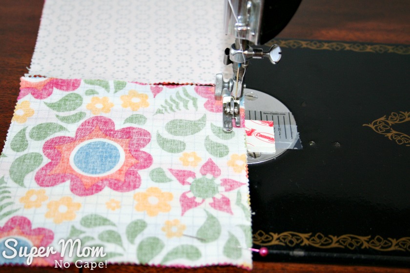 Photo of sewing charm squares together in pairs using the chain sewing method.