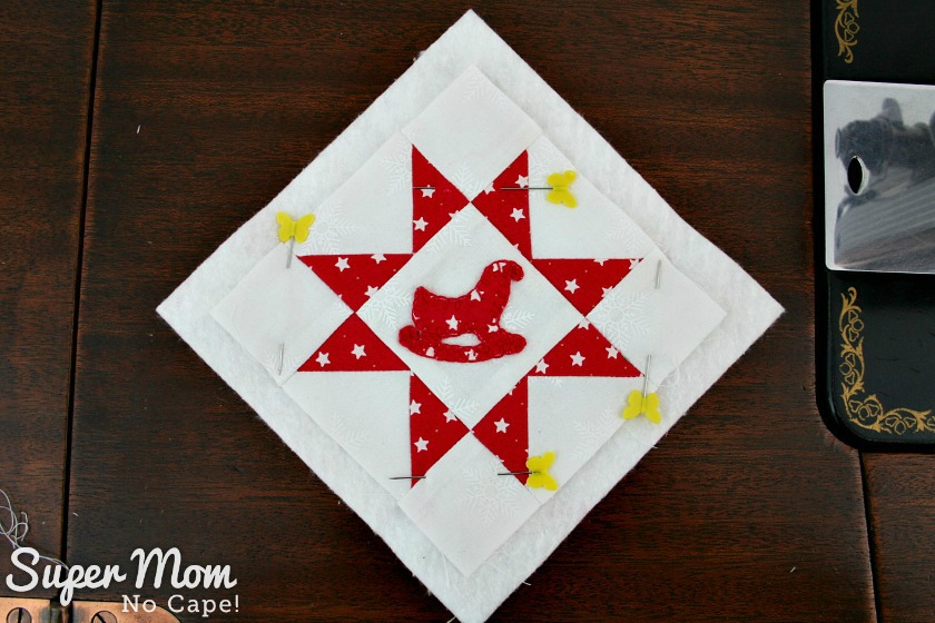 Sawtooth Star with Applique Center Ornament 30. Pin block to batting and backing