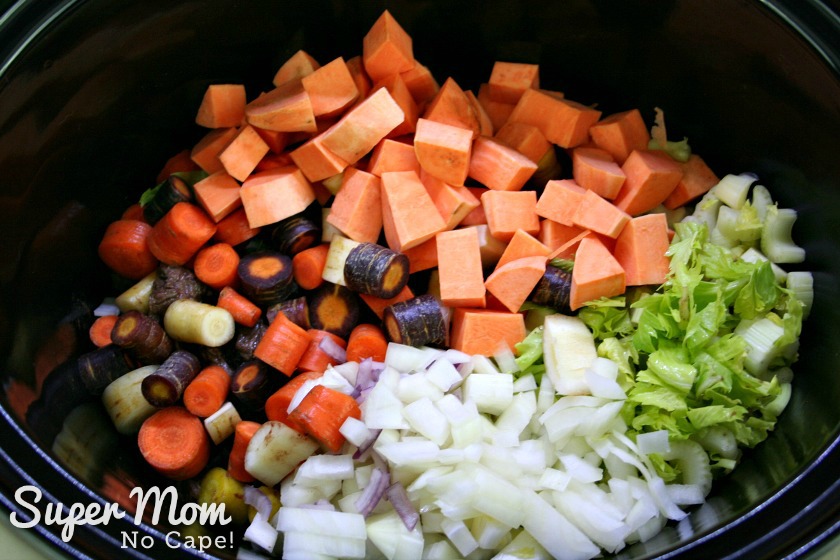 All the chopped vegetables added to the slow cooker.