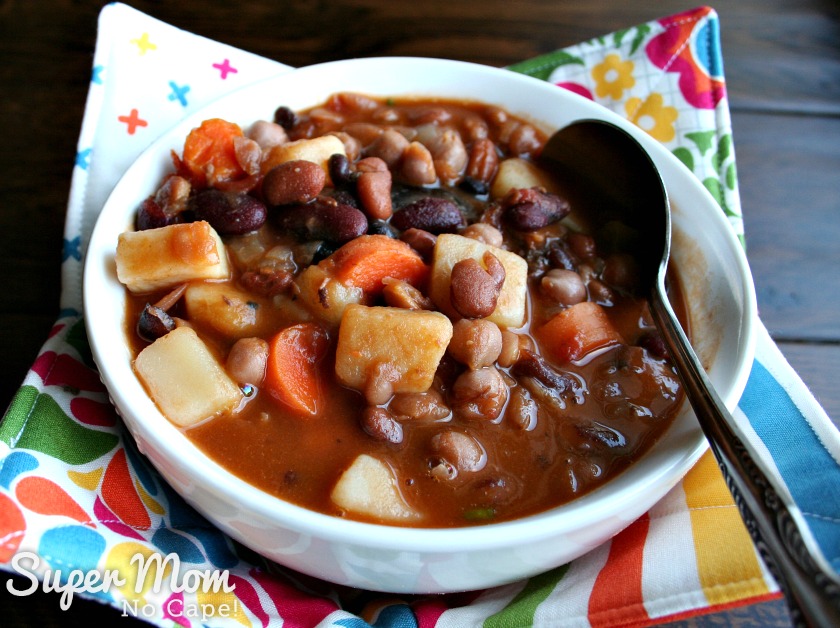 Homemade Bean Soup in white bowl in a soup bowl cozy