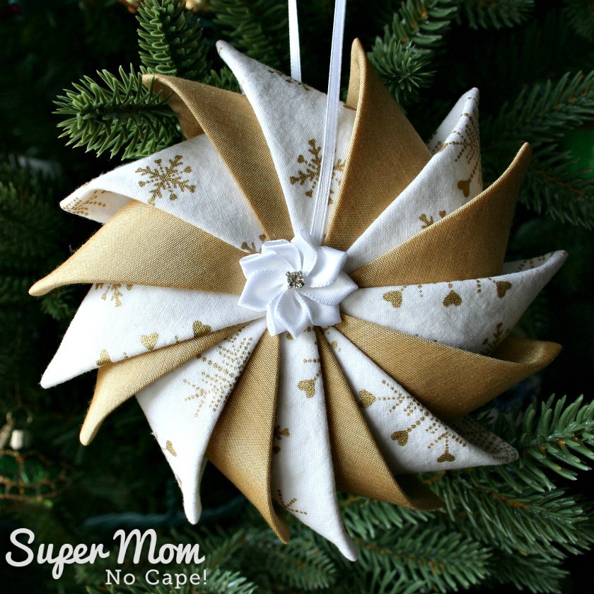 White and Gold Prairie Point Star Ornament with ribbon flower and rhinestone center