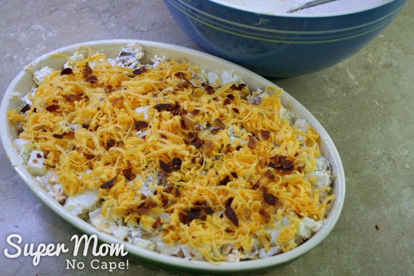 Grated cheddar cheese and crumbled bacon added to the top of the Leftover Baked Potato Casserole