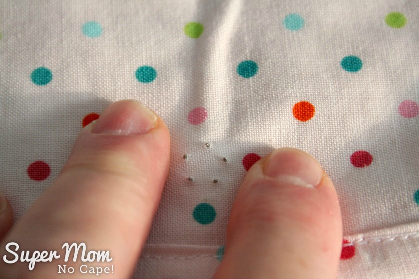  Make sure the prongs come through the lining fabric