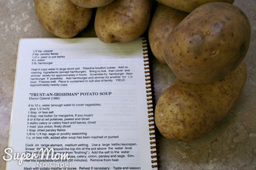 Cookbook opened to recipe called Trust an Irishman Potato Soup