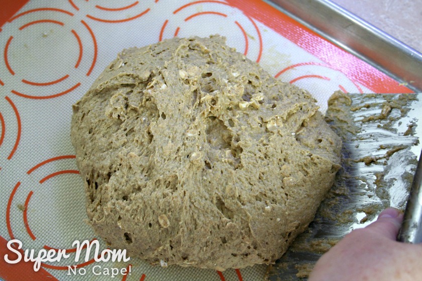 First photo of scooping the edges of the dough up to make a prettier shaped load of Irish Soda Bread