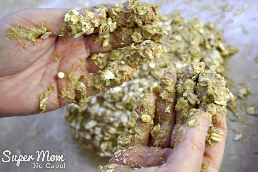 Hands covered in the sticky dough of the Irish Soda Bread