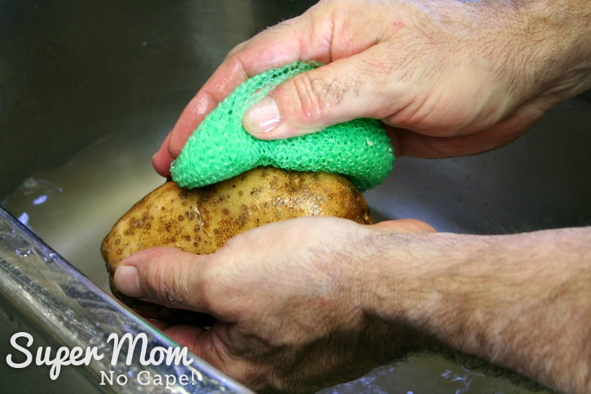 Scrubbing the potatoes for Twice Baked Potatoes to remove dirt