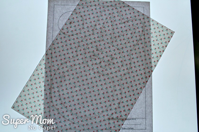 Tracing the rag quilt bunny pattern on one piece of fabric using a light box