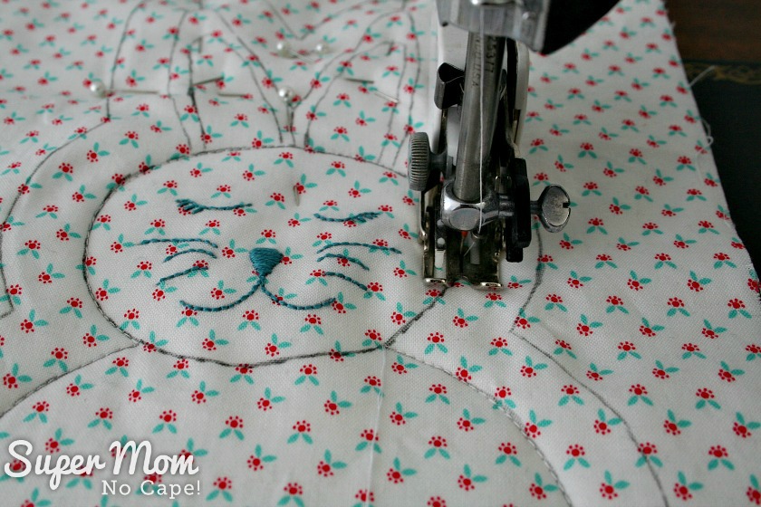 Sewing around the head of the rag quilt bunny