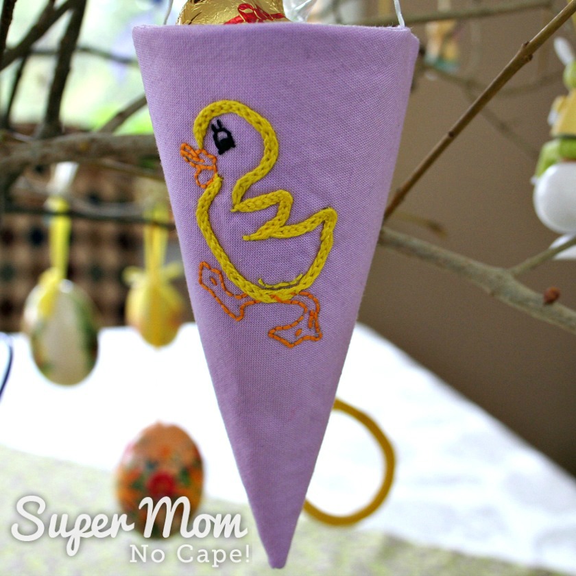 Fabric cone embroidered with a yellow duckling