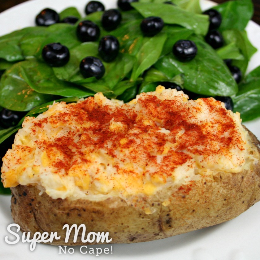 Twice Baked Potato served with spinach and blueberry salad for lunch