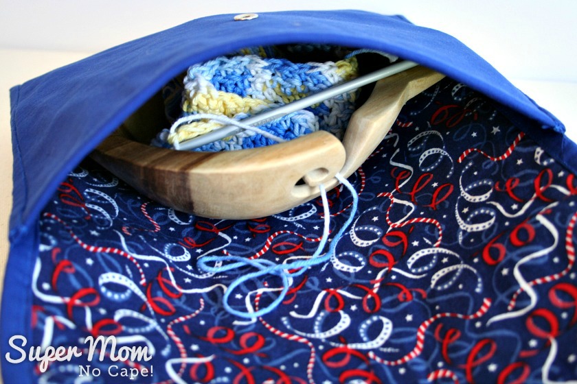 Yarn bowl and crochet in progress inside Making Waves Sashiko Embroidered Pouch