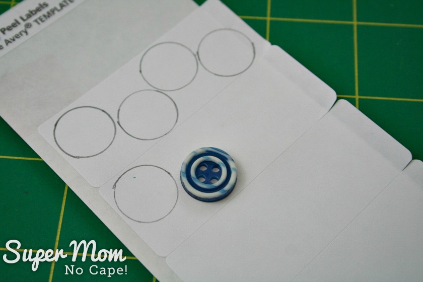  Tracing around button on white label paper