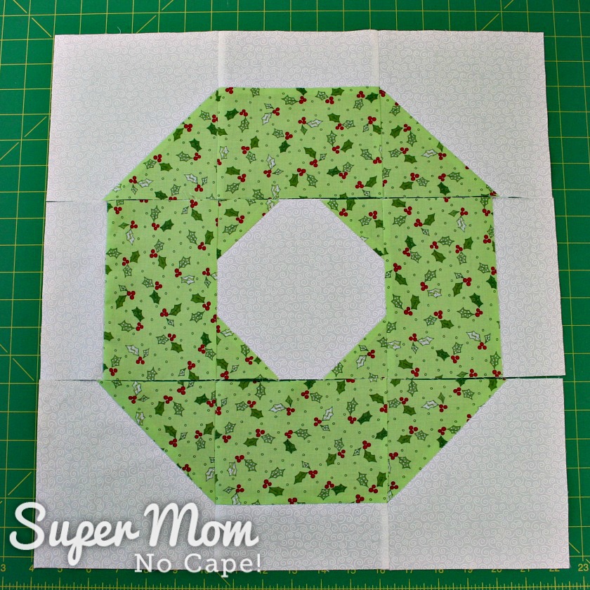 Three rows of Christmas Wreath Pillow Cover front sewn together