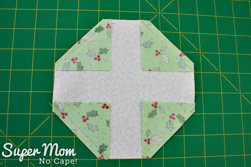 Corners trimmed on the center block for the Christmas Wreath Pillow Cover