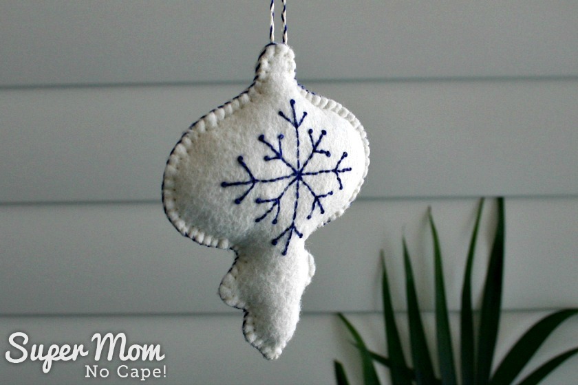 View 2 of White Felt Bauble with Blue Embroidered Snowflake