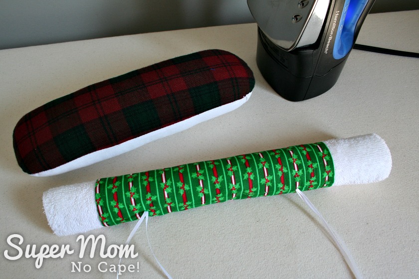 Photo demonstrating the use of a rolled up facecloth as a pressing ham