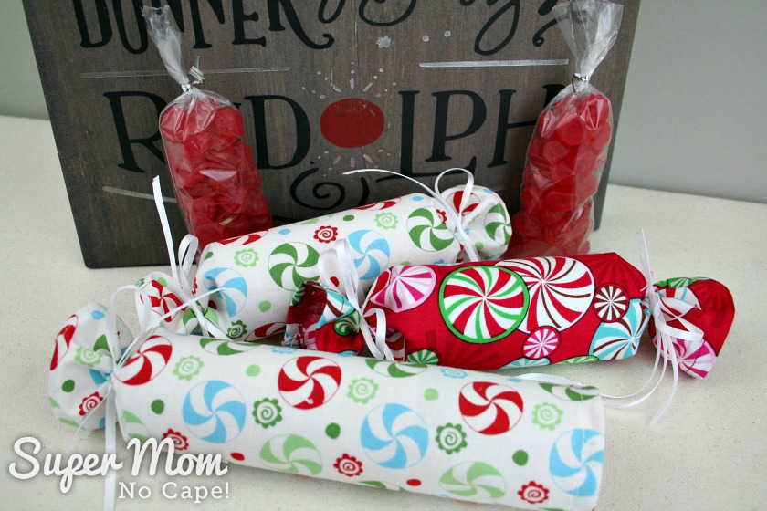 Small bags of red candy as filler for Fabric Christmas Crackers