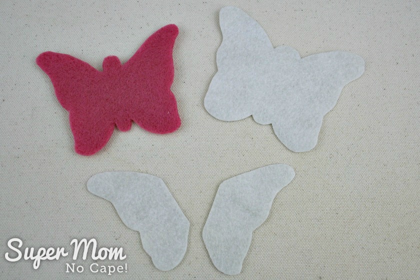 Remove the freezer paper from the felt butterfly pieces