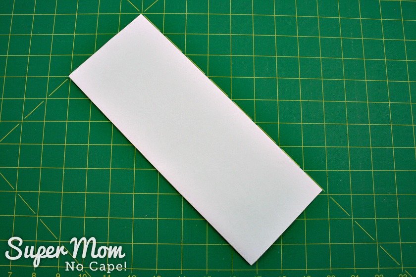 Fold paper in half lengthwise 