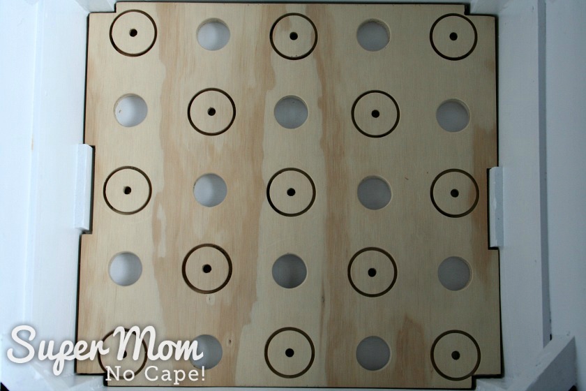 Close up of wood insert for serger spools