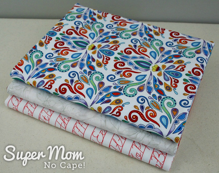 Three fabric book covers on composition books
