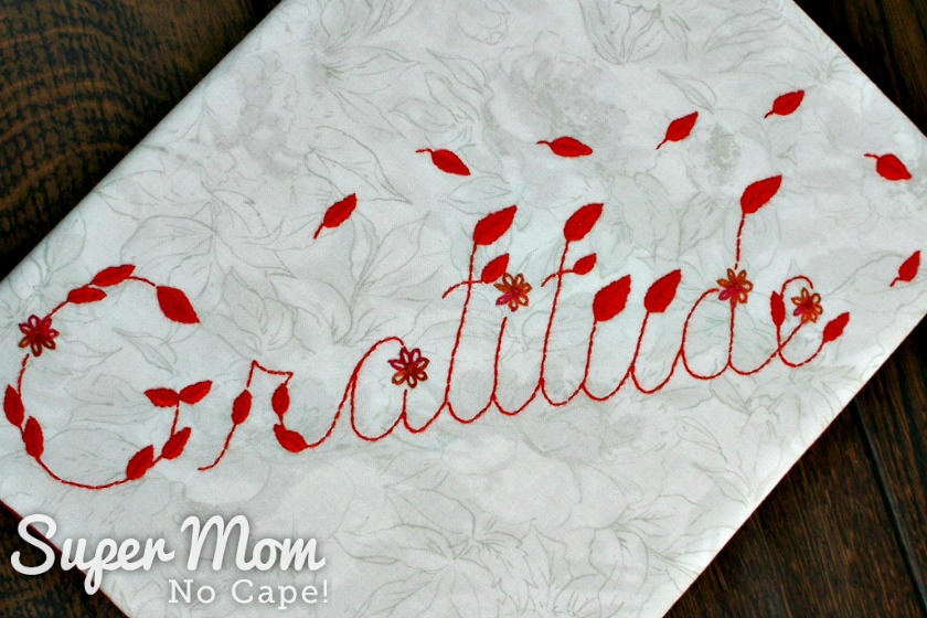 Gratitude Embroidery Pattern stitched onto tone on tone leaf fabric