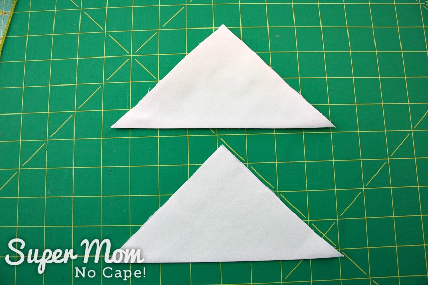 Folded fabric triangle for hanger