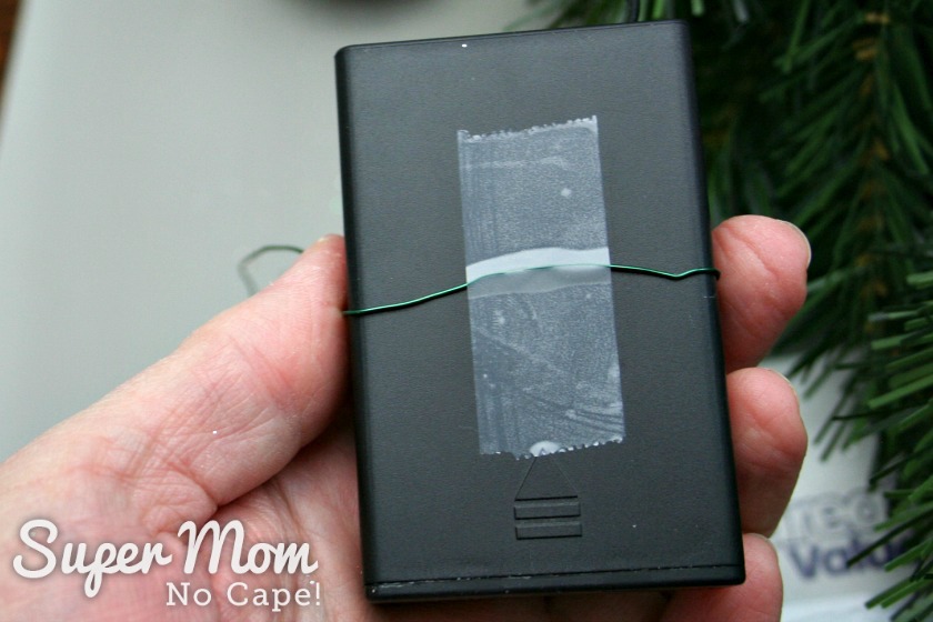 Floral wire taped to the back of the battery pack