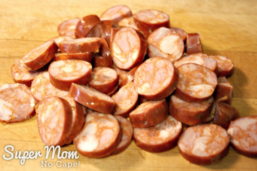 Sliced sausage meat for Jambalaya on a cutting board
